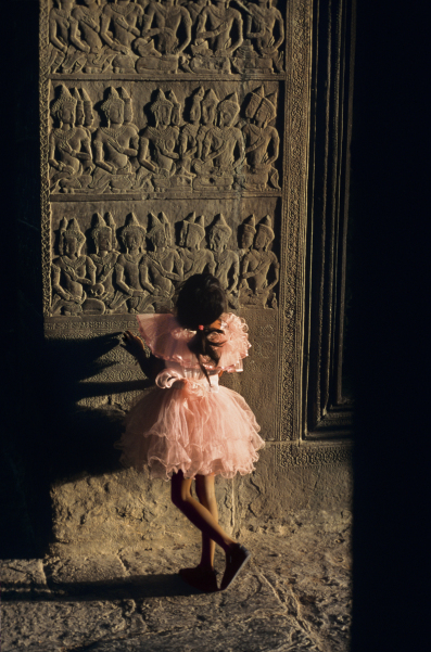 00056_04, Angkor Wat, Angkor, Cambodia, 1998, CAMBODIA-10111. A little girl looks at the carvings. Magnum Photos, NYC8848, MCS1998012 K041. Sanctuary: Temples of Angkor_Book Retouched_Ekaterina Savtsova 11/7/2013